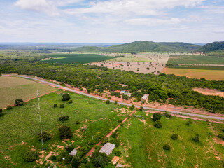 Fototapeta na wymiar Aerial landscape of farmland in Bom Jardim during summer in Nobres countryside in Mato Grosso