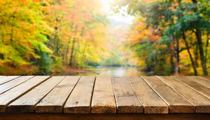 empty wooden table with autumn theme in background