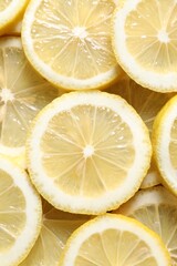Slices of fresh lemons as background, top view