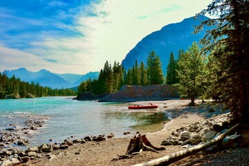 Beached Canoe on the banks of the Bow River in Banff Alberta Canada