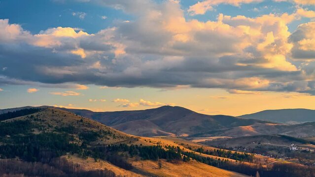 Nature sunset landscape cumulus clouds rolling over hills and mountains time-lapse