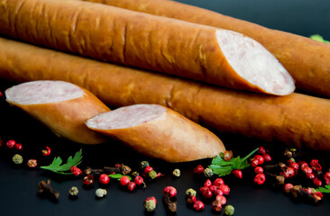 Tasty sausages and vegetables isolated over solid background