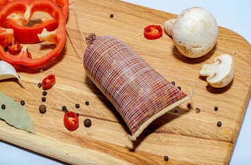 Tasty sausages and vegetables isolated over solid background