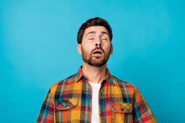 Photo portrait of handsome young male sneeze suffer allergy wear trendy plaid outfit isolated on blue color background