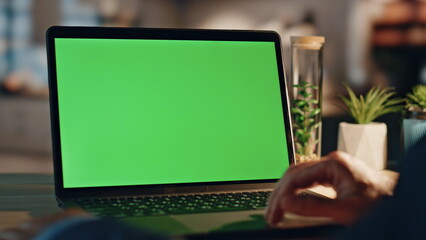 Manager fingers scrolling chromakey laptop touchpad working night home closeup