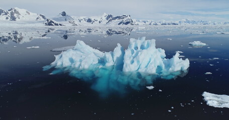 Global warming problem: iceberg melting at polar ocean bay aerial. Nature preserve and environment...