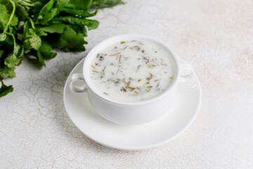 Azerbaijan traditional cuisine dovga, cooked from yoghurt and greens.