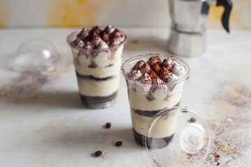 Traditional italian desert tiramisu in a jar.