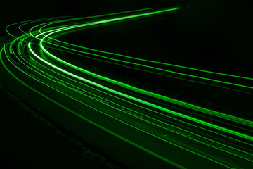 green car lights at night. long exposure