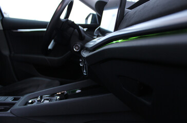 Green LED interior backlight on the front panel and dashboard inside the car side view from...