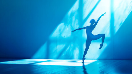 Graceful silhouette of a ballerina in blue light