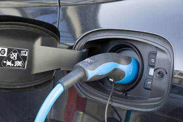 close up of charging an electrical car