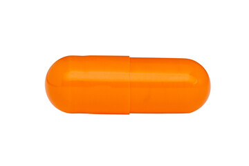 Orange capsule or pill isolated on white background.