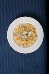 Orecchiette pasta with clam, creamy sauce and dill. Healthy food. on restaurant table 