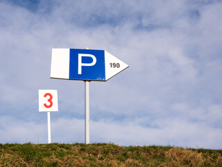 Parking spot sign and blue sky - 759083591