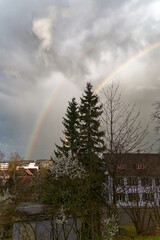 Beautiful double rainbow over Swiss City of Zürich with cloudy sky background on a late winter afternoon. Photo taken March 15th, 2024, Zurich, Switzerland.
