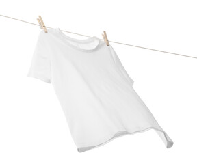 One t-shirt drying on washing line isolated on white, low angle view