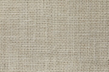 Fototapeta na wymiar Texture of beige fabric as background, top view