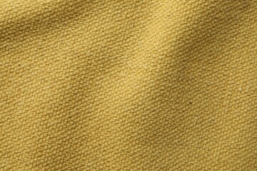 Texture of golden color fabric as background, top view