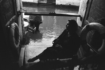 A Woman Sitting In An Armchair In Venice