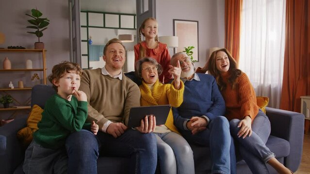 Caucasian family using tablet and connecting it to tv