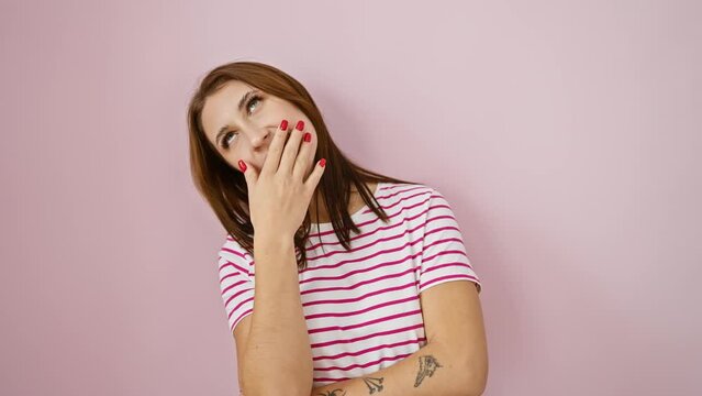Sleepy morning yawn, beautiful young russian brunette bored, tired and yawning, covering mouth with hand in striped pink tshirt over isolated background