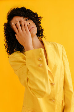 Young woman covering face with hand
