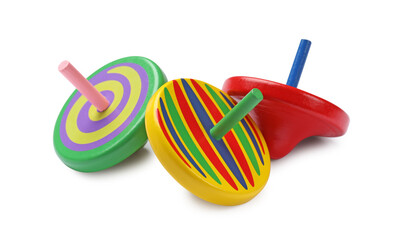 Many bright spinning tops isolated on white