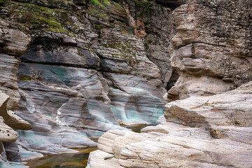 Tasyaran canyon, which attracts attention with its rock shapes similar to Antelope canyon in Arizona, offers a magnificent view to its visitors. Canyon view and stream at sunset. Usak, Turkey.