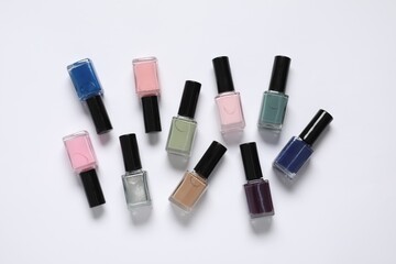 Nail polishes on white background, flat lay