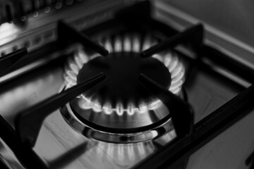 kitchen gas stove alight with flame coming out of it. Conceptual photo for gas, cost of bills,...