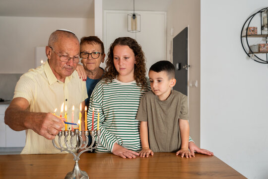 Jewish Family Celebrates Hanukkah at Home.