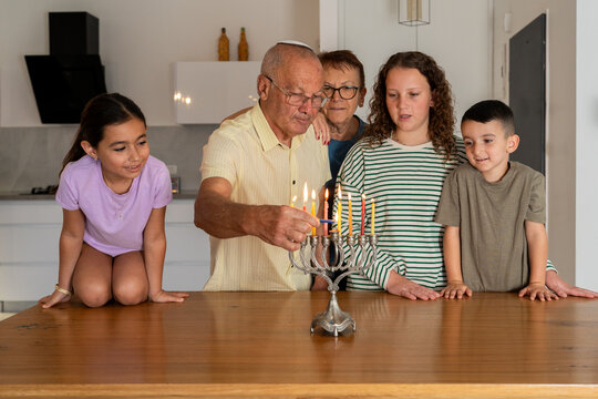 Traditional Hanukkah Candle Lighting with Family,