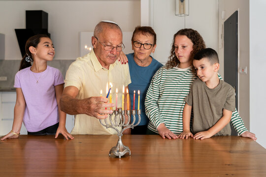 Traditional Hanukkah Candle Lighting with Family,