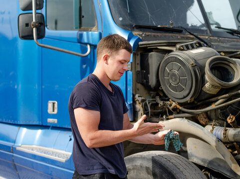 Mechanic Checking truck Car Oil