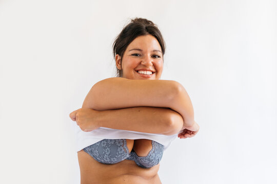 Beautiful Woman Taking Off Vest