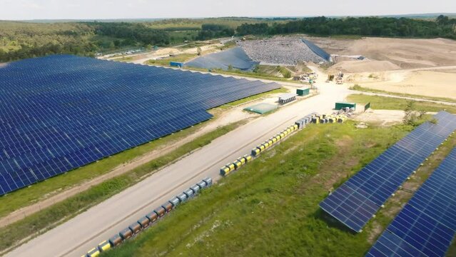 Large drone view of installation solar panels in waste reprocessing center