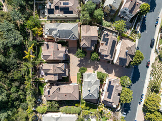 Aerial view of middle class subdivision neighborhood with residential condos and houses in San Diego, California, USA.