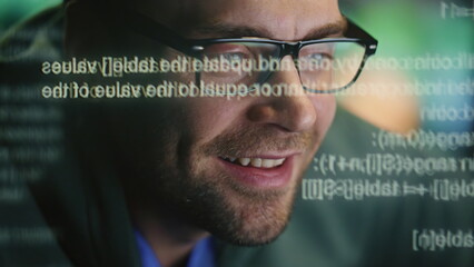 Happy expert creating code at data hologram closeup. Developer man programming