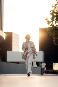 Hijab Businesswoman doing a phone call while Walking