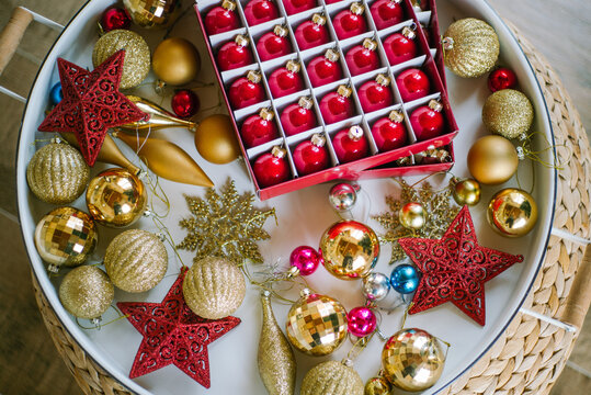 Still life with various Christmas tree decorations on the tray