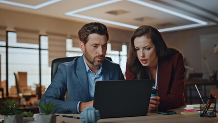 Serious colleagues checking project results agency closeup. Business team work