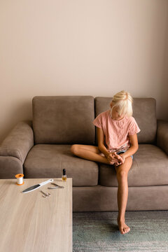Little girls treats her foot with callus