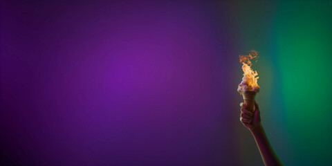 A hand holding an ice cream with flames coming out of it resembles an Olympic torch, the background is green and purple