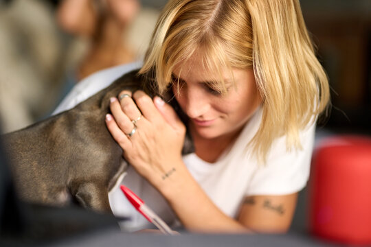 Caressing her puppy