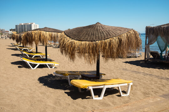 Empty long beach with parasols, Rhodes, Greece