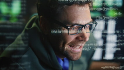Happy specialist creating code at data hologram closeup. Smiling man programming