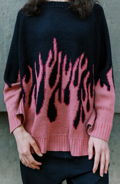 Person with sweater with pink pattern