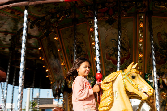 little girl at carrousel 