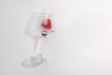 Tasty red wine in glass isolated on white, top view